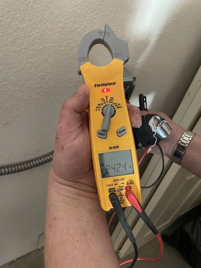 Voltage testing with clamp meter during Ceiling Fan Installation in Broadalbin